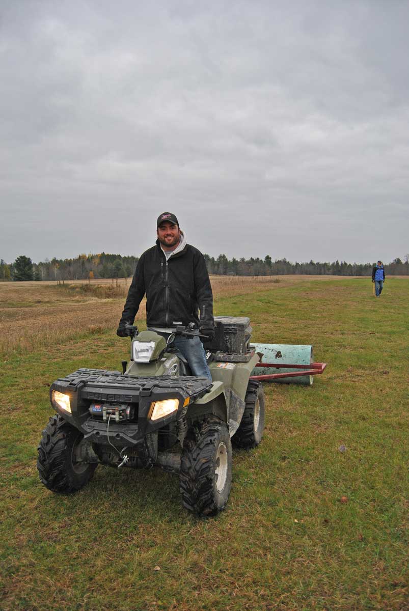 Darren Rolling the field at the Fall Clean Up and AGM